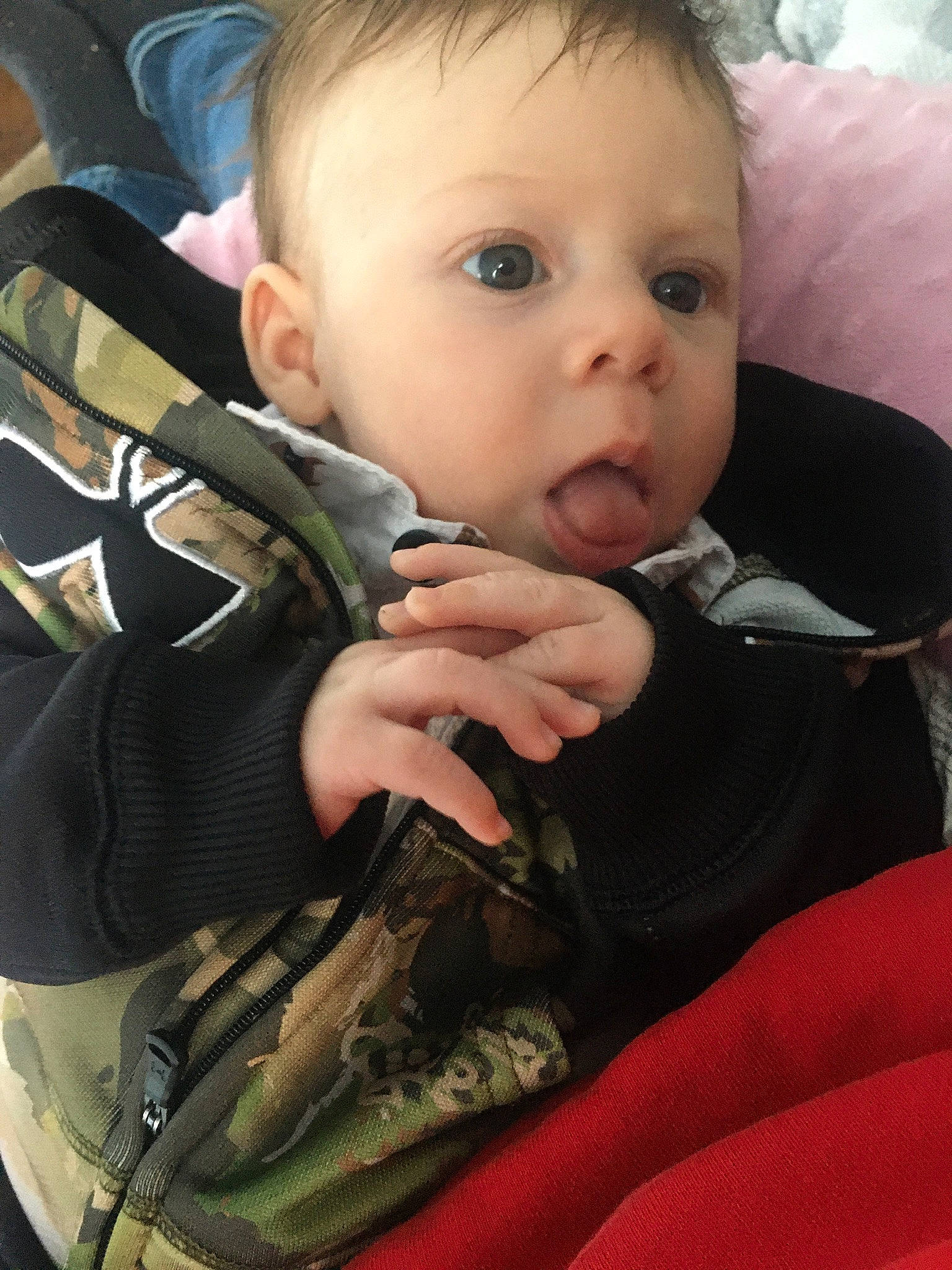 Lawrence is registered to the contest to win money with this photo: baby, baby_carriage, car_seat, cheek, child, eye, face, finger, head, mouth, nose, person, skin, surprise, toddler