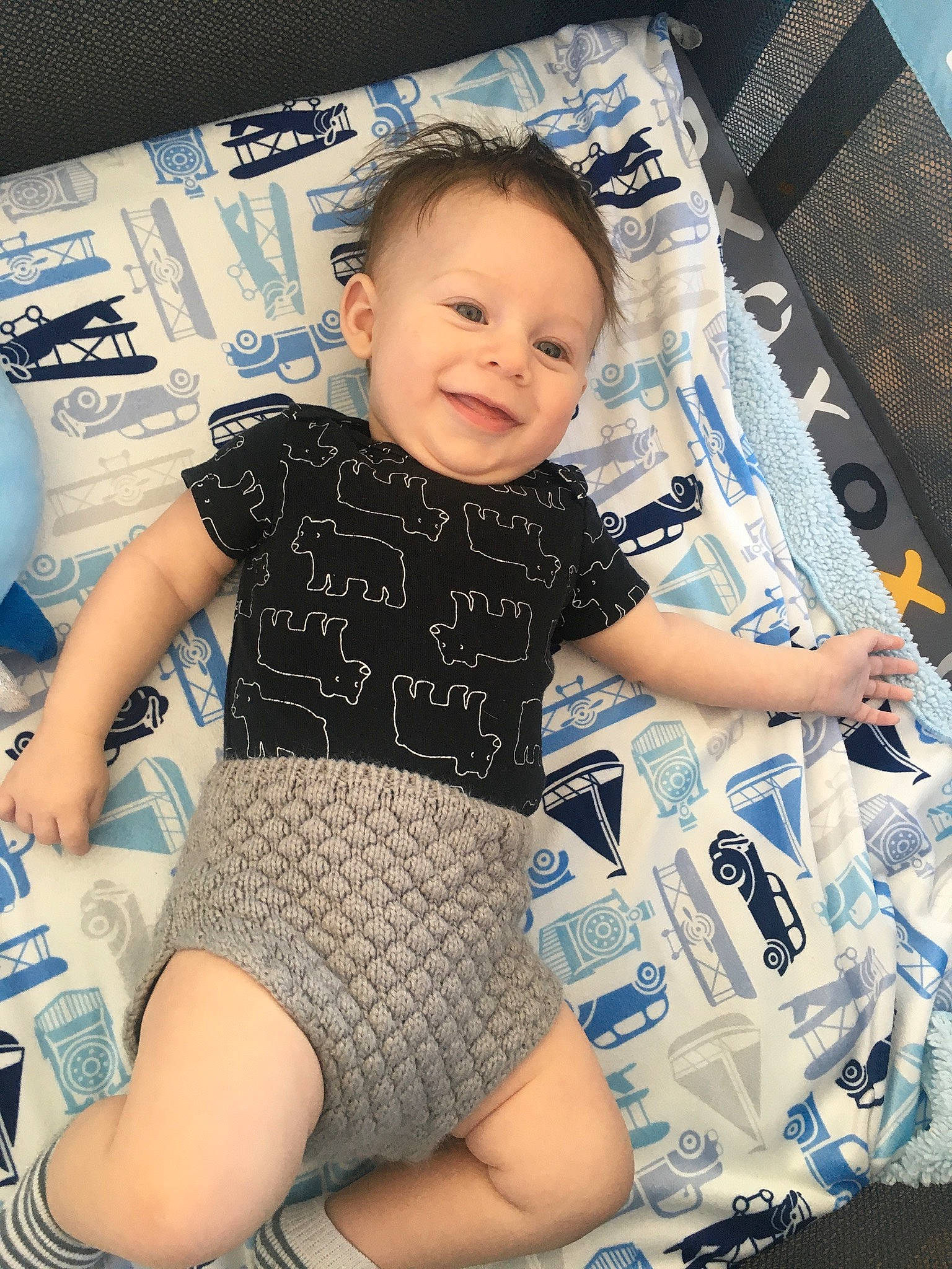 Lawrence is registered to the contest to win money with this photo: baby, baby_carriage, baby_products, baby_toddler_clothing, blue, child, head, joy, leg, pattern, person, product, sitting, skin, sleeve, t_shirt, toddler