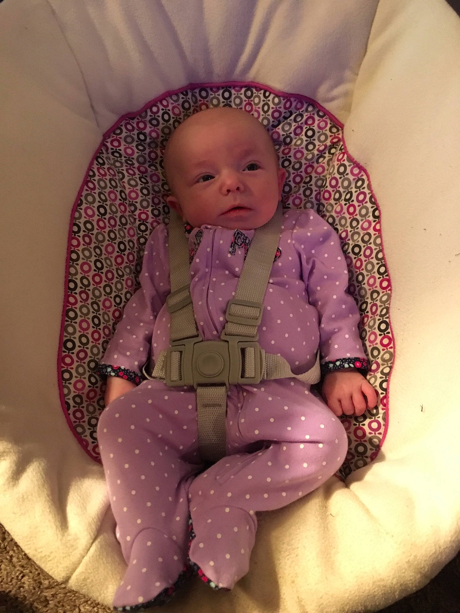 Samara is registered to the contest to win money with this photo: baby_products, child, eye, girl, infant, iris, person, pink, product, purple, sitting, skin, textile, toddler