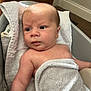 Lawson is registered to the contest to win money with this photo: baby, infant, towel, bath, skin, face, arm, expression, indoors, wood, carpet, blanket, cute, child, person, newborn, soft, water, comfort, portrait