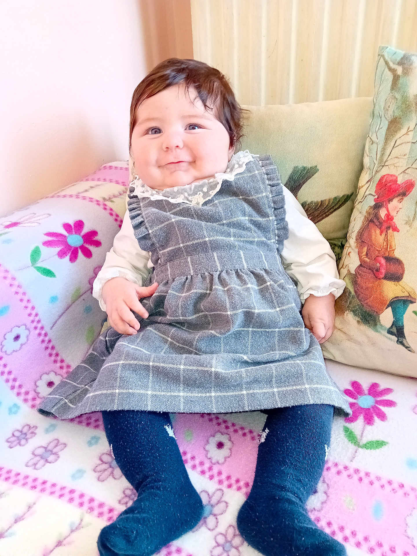 Candice participe au concours pour gagner de l'argent avec cette photo : baby, child, smiling, dress, tights, blanket, pillow, indoor, portrait, cute, happy, seated, cozy, patterned, fabric, person, clothing, home, infant, sitting