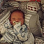 newborn, baby, pacifier, blanket, swaddled, infant, sleepy, patterned, cushion, soft, bed, rest, comfort, child, clothing, indoor, portrait, cute, wrapped, peaceful