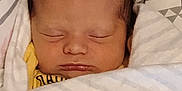 Giovanni is registered to the contest to win money with this photo: baby, newborn, sleeping, blanket, swaddled, face, infant, peaceful, soft, striped_blanket, closeup, indoors, cute, resting, person, head, skin, toddler, cozy, quiet