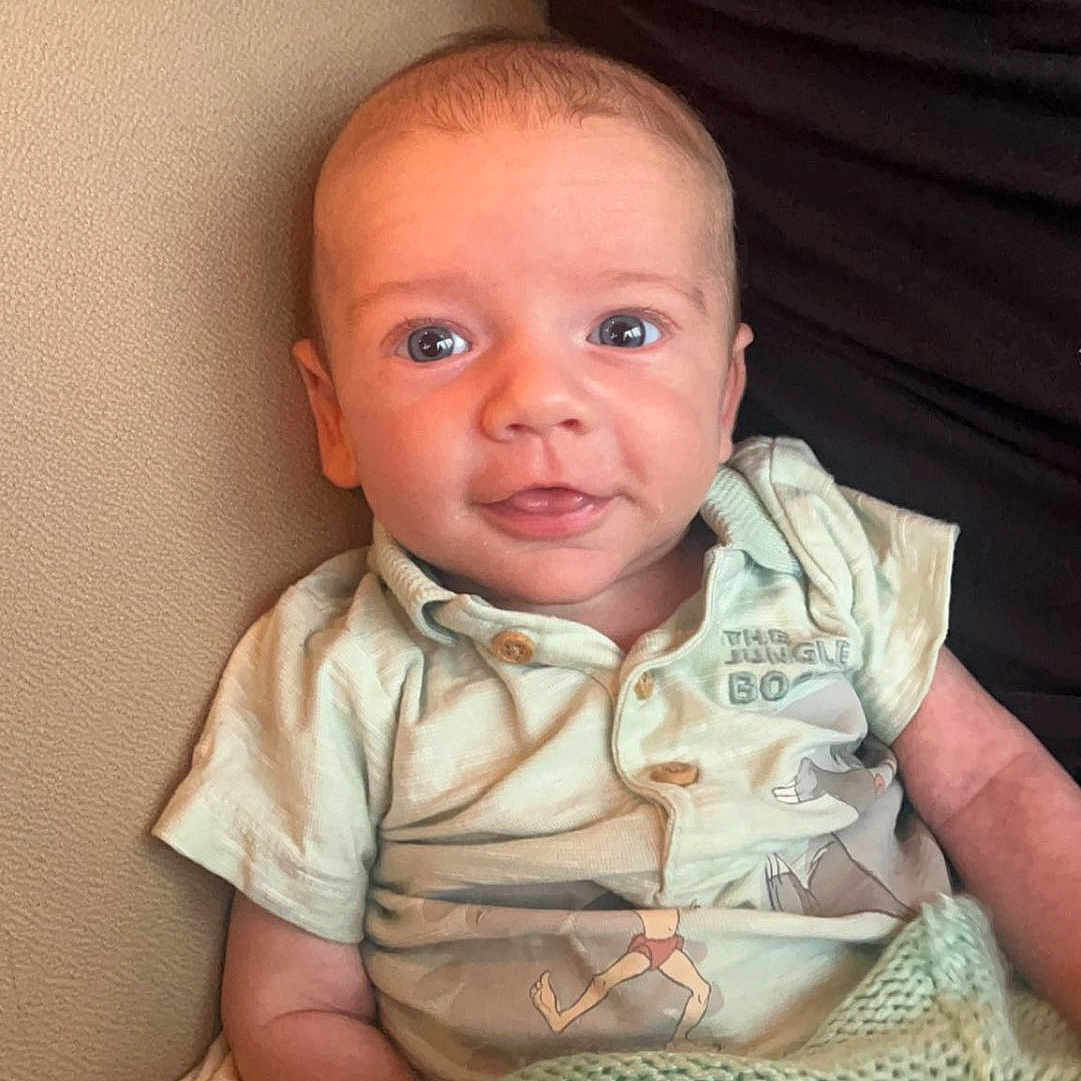 Edmund joined the competition — help win amazing prizes! baby, bed, bedroom, blanket, clothing, couch, cushion, face, furniture, happy, head, homedecor, indoors, newborn, person, photography, portrait, room, smile, t_shirt