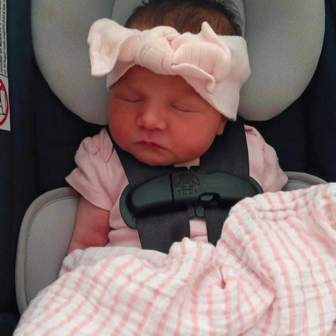 Roselyn is registered to the contest to win money with this photo: baby, blanket, bow, bundle, car_seat, child, closeup, cute, headband, indoors, infant, newborn, pacifier, peaceful, pink, portrait, resting, sleeping, soft, strap