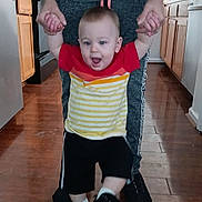 Jacob joined the competition — help win amazing prizes! toddler, child, adult, hands, walking, kitchen, floor, tattoos, shorts, tshirt, shoes, wooden_floor, cabinets, smiling, person, indoor, home, helping, support, movement