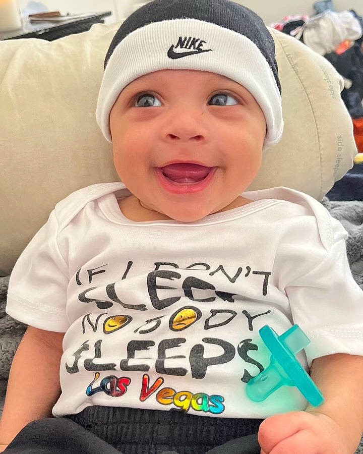 Amir is registered to the contest to win money with this photo: baby, baby_laughing, baby_toddler_clothing, cap, cheek, child, cool, eye, facial_expression, happy, headwear, joy, mammal, mouth, organ, people, person, sleeve, smile, t_shirt