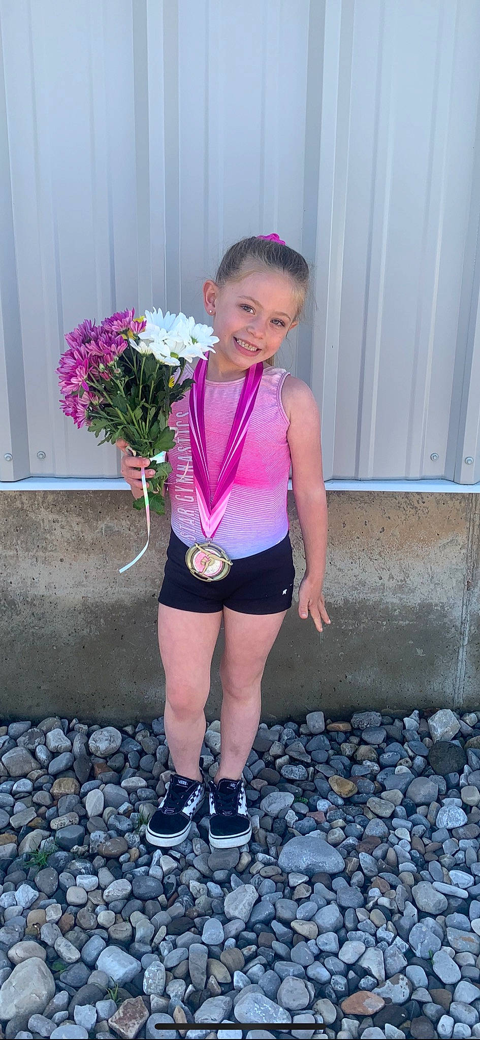 Breeslynn is registered to the contest to win money with this photo: baby_toddler_clothing, electric_blue, flower, hair, happy, human_leg, joy, knee, leg, magenta, person, petal, pink, plant, shoulder, smile, street_fashion, t_shirt, thigh, toddler