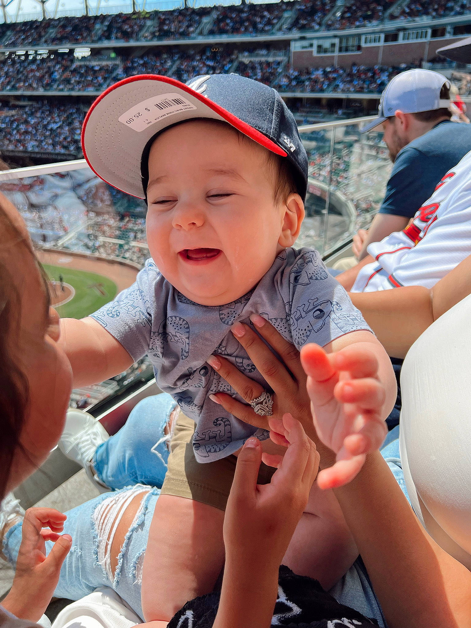 Alexander is registered to the contest to win money with this photo: baseball_cap, cap, child, cool, finger, fun, gesture, hand, happy, hat, headwear, lap, leisure, mouth, person, skin, smile, summer, thigh, thumb