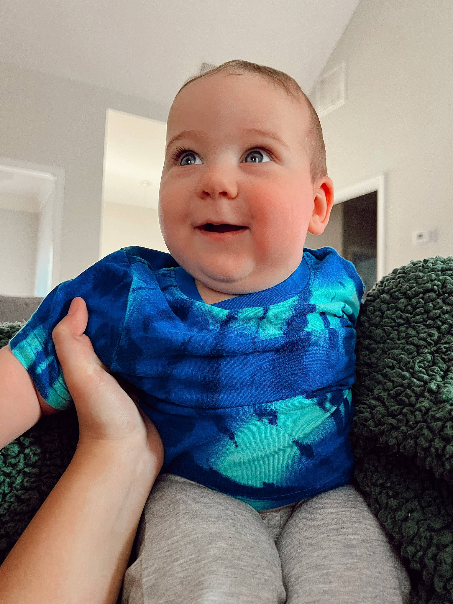 Alexander is registered to the contest to win money with this photo: azure, baby, baby_toddler_clothing, cheek, comfort, cool, eye, happy, head, iris, leg, mouth, neck, person, skin, sleeve, smile, standing, t_shirt, toddler