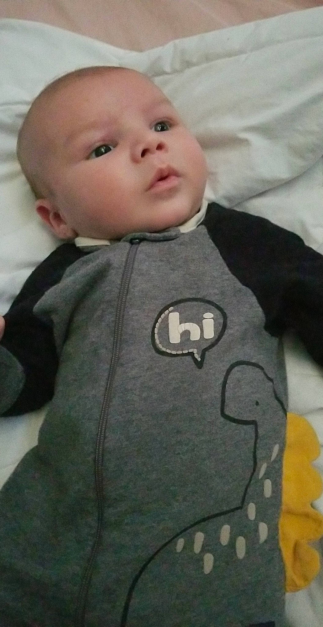 Cayde joined the competition — help win amazing prizes! baby, baby_products, baby_toddler_clothing, cheek, child, collar, comfort, face, grey, jacket, mammal, organ, outerwear, pattern, person, personal_protective_equipment, skin, sleeve, t_shirt, textile