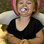 Kelly a rejoint le concours — aidez-le/la à gagner de superbes lots ! toddler, child, pacifier, hat, smile, sitting, outdoor, happy, person, clothing, black_shirt, shorts, face, hands, chair, summer, nature, blurry_background, cute, portrait