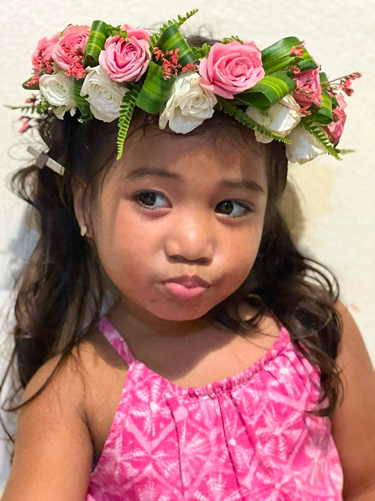 Leila Aiyan is registered to the contest to win money with this photo: beauty, child, chin, face, facial_expression, fashion, flower, flower_arranging, hairstyle, happy, headgear, headpiece, long_hair, magenta, person, petal, pink, plant, rose, toddler