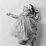 Rosita is registered to the contest to win money with this photo: baby, infant, sleeping, dress, headband, flower, black_and_white, tulle, peaceful, cute, child, socks, portrait, studio, calm, adorable, soft_lighting, laying_down, young, female