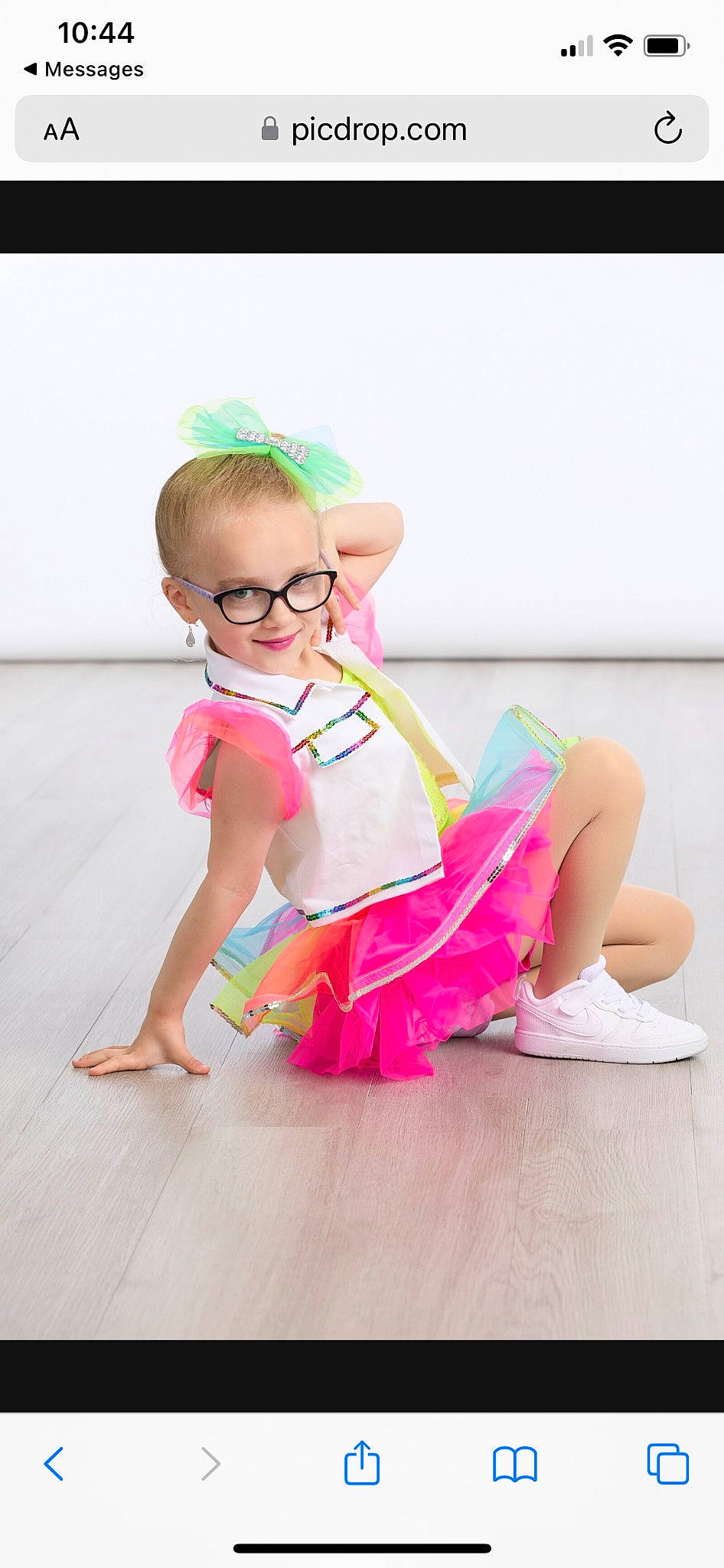 Bryleigh joined the competition — help win amazing prizes! baby_toddler_clothing, barefoot, child, dress, eyewear, fashion_accessory, flooring, foot, fun, happy, hardwood, human_leg, joy, leisure, magenta, person, pink, sitting, smile, sock