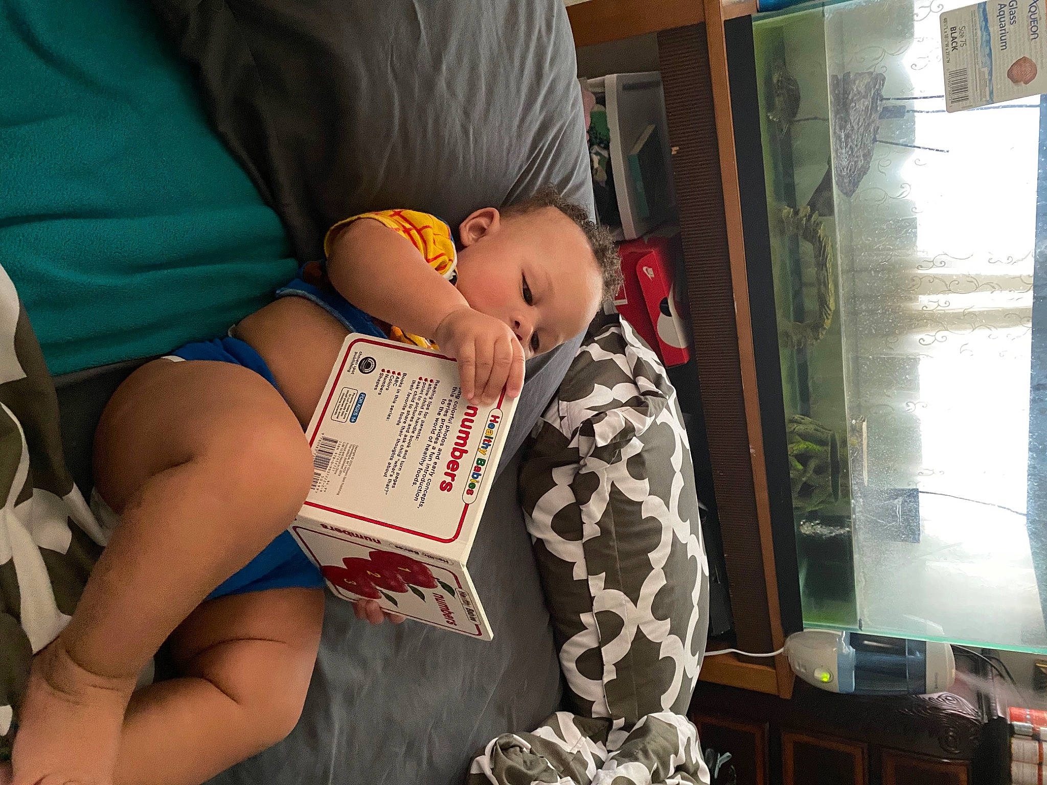 Aaron joined the competition — help win amazing prizes! child, comfort, elbow, finger, foot, fun, hairstyle, human_body, human_leg, joint, knee, lap, leg, nail, office_equipment, pattern, person, sitting, textile, thigh