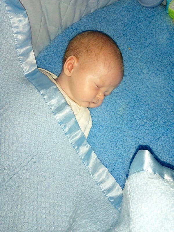 Brady joined the competition — help win amazing prizes! arm, baby, baby_products, baby_sleeping, child, comfort, ear, electric_blue, finger, hand, human_body, joint, linens, mouth, nose, person, room, skin, textile, thumb