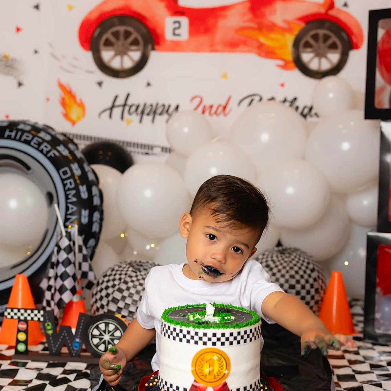 Xavier is registered to the contest to win money with this photo: baby, birthdaycake, cake, car, clothing, cream, dessert, face, food, fun, head, machine, party, people, person, photography, portrait, transportation, vehicle, wheel