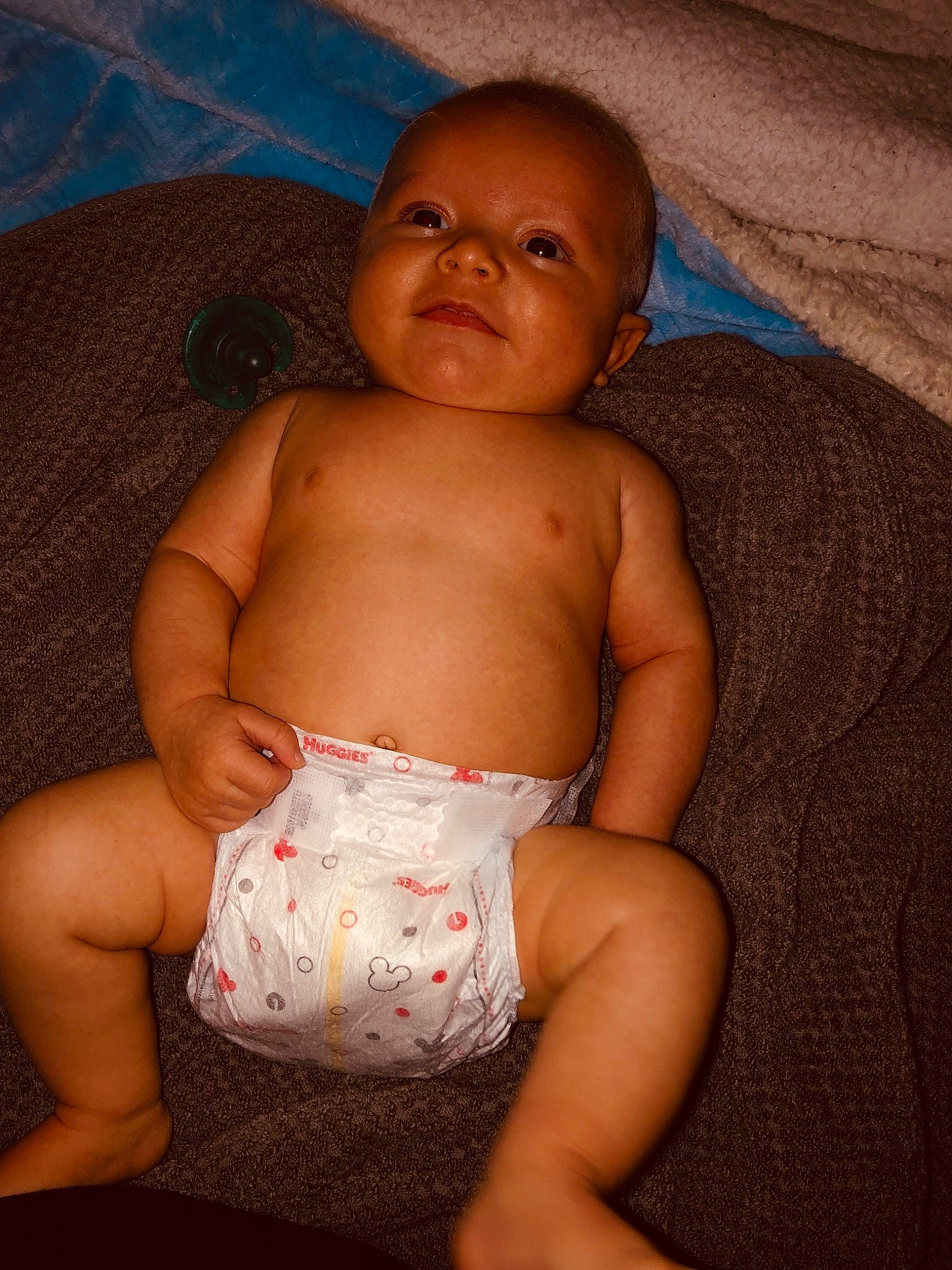 Bryson is registered to the contest to win money with this photo: abdomen, cheek, child, eye, finger, girl, hand, infant, muscle, person, sitting, skin, smile, toddler, trunk