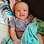 Kiah joined the competition — help win amazing prizes! baby, infant, smile, blanket, striped_clothing, hand, face, cute, child, comfort, soft_texture, indoors, seated, happy, cozy, young, portrait, warm, skin, eyes