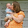 William joined the competition — help win amazing prizes! affection, baby, child, door, family, floral_dress, happy, holding, kiss, outdoor, pacifier, paint, person, portrait, short_sleeves, skin, smile, weathered, woman, wood