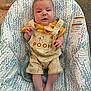 baby, child, infant, pooh, overalls, pacifier, baby_seat, pattern, clothing, foot, hand, carpet, indoor, cute, face, person, sitting, yellow, striped_shirt, plush