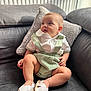 Imrân participe au concours pour gagner de l'argent avec cette photo : baby, casual, child, clothing, comfortable, couch, cute, face, footwear, furniture, hands, indoors, infant, legs, looking_away, natural_light, pillow, shoes, sitting, soft_texture