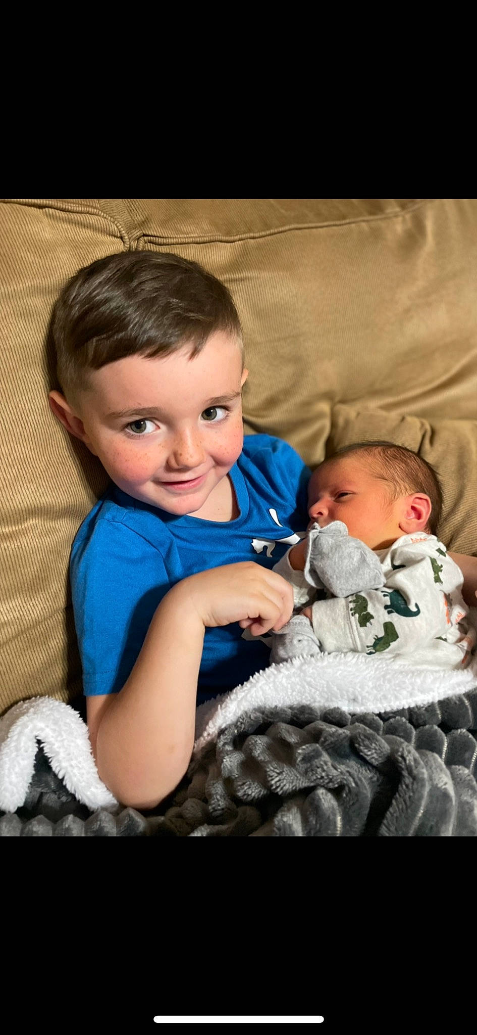 Leo is registered to the contest to win money with this photo: baby, baby_toddler_clothing, cheek, child, comfort, couch, eye, face, flash_photography, fun, fur, happy, head, iris, joy, nose, person, room, sitting, skin