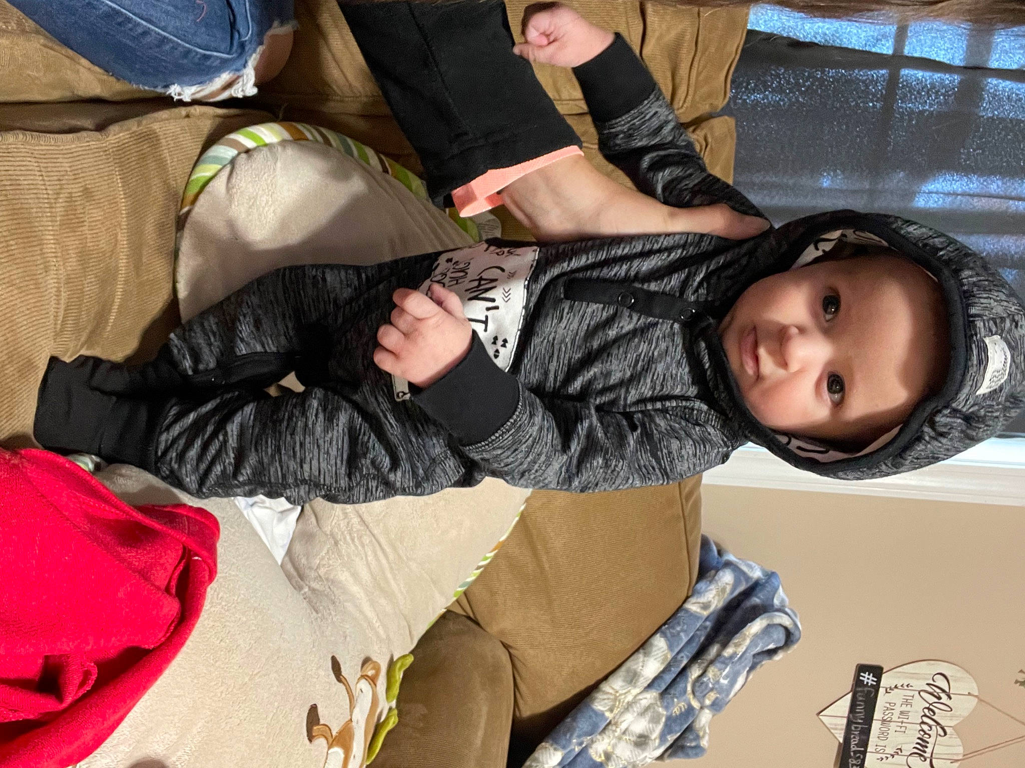 Clayton joined the competition — help win amazing prizes! baby_products, bag, child, comfort, fun, headwear, human_leg, knee, lap, leg, leisure, luggage_and_bags, nap, person, product, room, sitting, sleeve, sneakers, sock