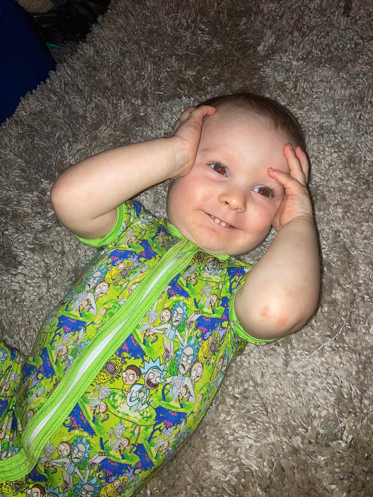 Billy joined the competition — help win amazing prizes! baby, child, onesie, rick_and_morty, carpet, smile, hands, face, red_eye, playful, cute, lying_down, infant, clothing, patterned, bright, skin, happy, expression, indoors