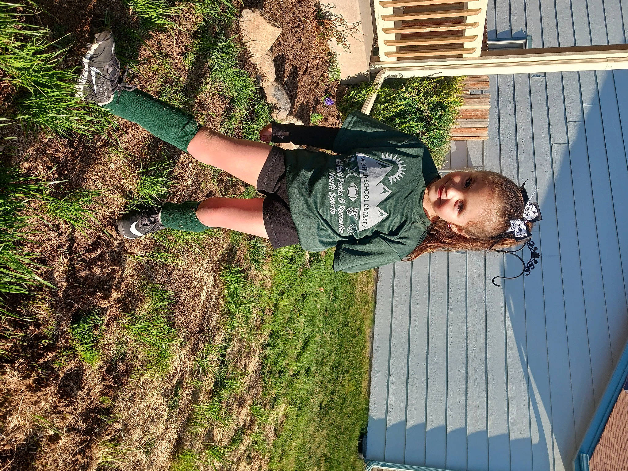 Briella joined the competition — help win amazing prizes! blue, elbow, fun, grass, happy, human_leg, joy, knee, leisure, people_in_nature, person, plant, shadow, shorts, smile, soil, t_shirt, thigh, tree, walking_shoe