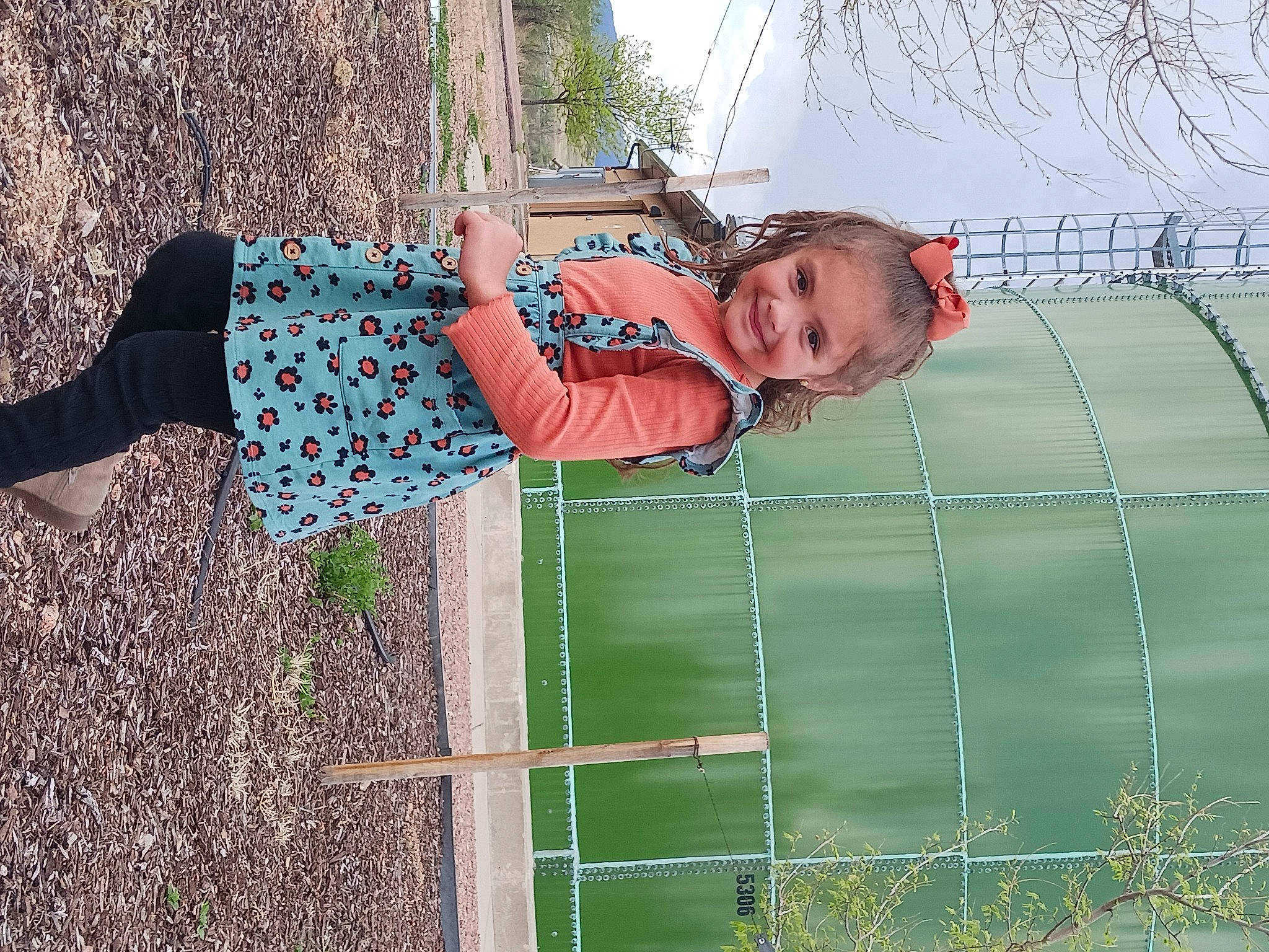 Briella joined the competition — help win amazing prizes! chain_link_fencing, child, fence, fun, grass, happy, joy, leisure, mesh, net, pattern, people_in_nature, person, plant, recreation, sky, smile, toddler, tree, water