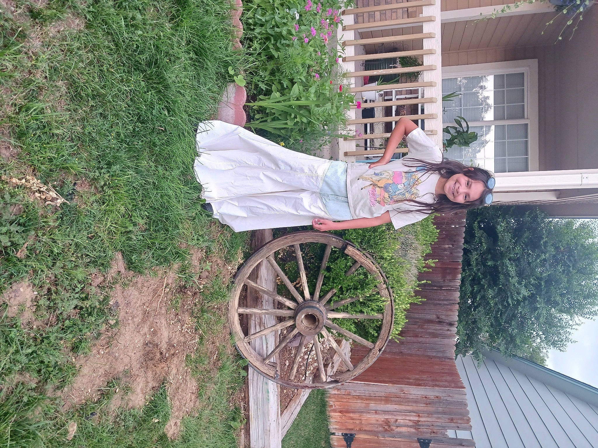 Leah joined the competition — help win amazing prizes! automotive_wheel_system, building, carriage, fun, grass, house, joy, landscape, leisure, person, plant, smile, soil, tire, tree, vehicle, wheel, window, wood