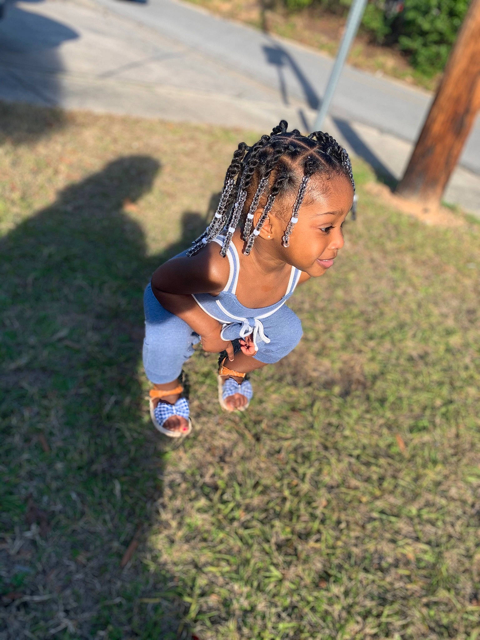 De Lanie is registered to the contest to win money with this photo: child, fun, grass, happy, leisure, outdoor_play_equipment, person, photography, plant, play, playground, smile, summer, sunlight, swing, toddler, tree, vacation