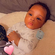 De'Andre joined the competition — help win amazing prizes! baby, infant, child, portrait, lying_down, blanket, fluffy_blanket, bed, pajamas, pacifier, face, eyes, hair, relaxed, indoors, cozy, candid, photography, heart, date
