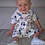 Amaël participe au concours pour gagner de l'argent avec cette photo : baby, casual, child, couch, cute, footwear, happy, indoor, infant, leather, mickey_mouse, patterned_clothing, person, portrait, shoes, shorts, sitting, smiling, white_clothing, young_child