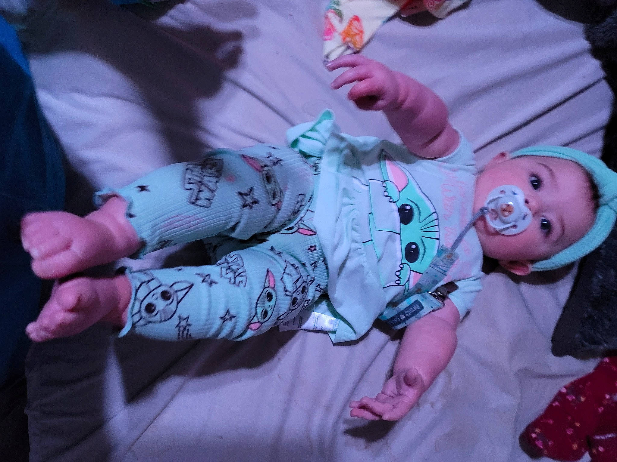 Evangeline is registered to the contest to win money with this photo: baby, baby_products, baby_toddler_clothing, child, event, finger, gesture, grass, hand, happy, headwear, human, mouth, nail, pattern, person, sitting, sleeve, smile, tableware