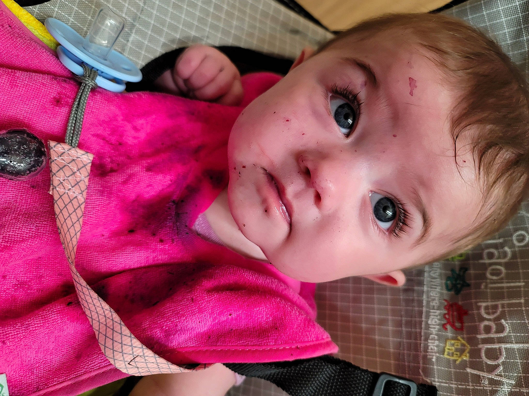 Evangeline is registered to the contest to win money with this photo: baby, baby_toddler_clothing, cheek, eyebrow, eyelash, forehead, iris, lip, magenta, mouth, nose, pattern, person, pink, plant, red, skin, sleeve, toddler, tree