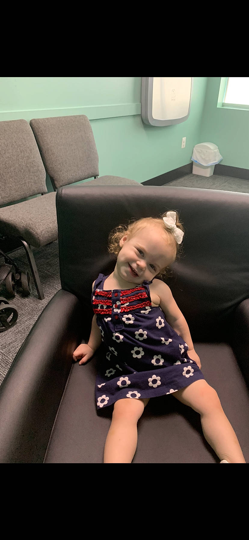 Lorelai is registered to the contest to win money with this photo: arm, baby_toddler_clothing, comfort, couch, dress, facial_expression, finger, flash_photography, floor, fun, furniture, hairstyle, happy, joint, joy, leg, one_piece_garment, person, shoulder, skin