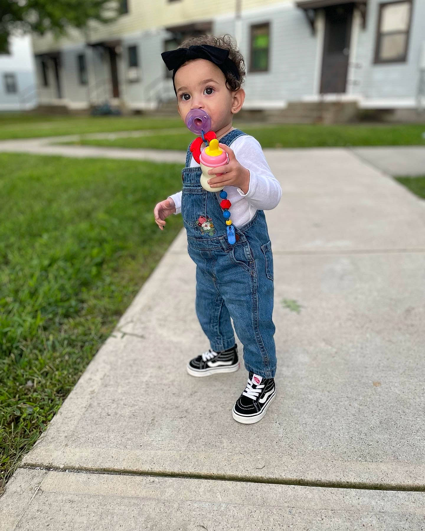 Treasure is registered to the contest to win money with this photo: asphalt, child, denim, eye, face, footwear, fun, grass, happy, head, leisure, person, plant, recreation, road, road_surface, sidewalk, sneakers, street_fashion, surprise