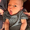 Alaina joined the competition — help win amazing prizes! baby, infant, tongue_out, onesie, clothing, skin, face, eyes, arms, hands, blanket, soft_fabric, resting, cute, expression, indoor, human, newborn, portrait, playful