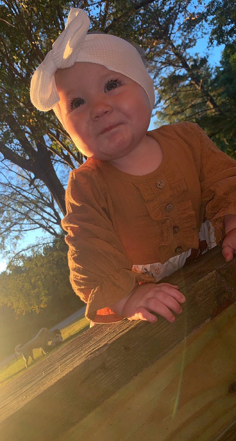 Hadlee is registered to the contest to win money with this photo: baseball_cap, cap, facial_expression, finger, flash_photography, fun, grass, hand, happy, headwear, leaf, person, pink, skin, sky, smile, standing, summer, sunlight, toddler