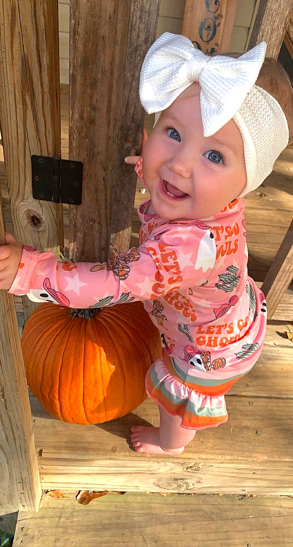 Hadlee joined the competition — help win amazing prizes! baby, baby_toddler_clothing, beauty, calabaza, cap, child, eye, fashion_accessory, fun, happy, headgear, headwear, joy, peach, person, pink, pumpkin, sitting, sleeve, smile