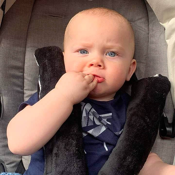 Freddie is registered to the contest to win money with this photo: baby, baby_toddler_clothing, cheek, comfort, ear, eyebrow, eyelash, finger, gesture, happy, iris, lip, mouth, neck, nose, outerwear, person, skin, sleeve, thumb