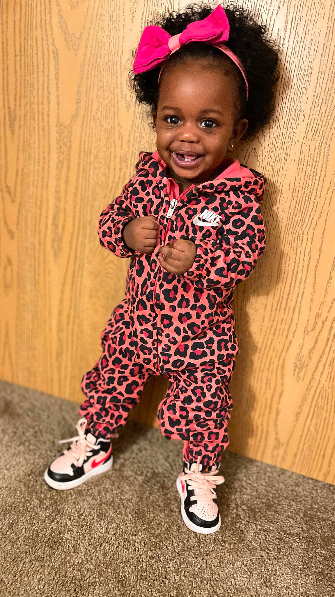 Kari joined the competition — help win amazing prizes! baby, baby_toddler_clothing, child, cool, fashion_accessory, flooring, fun, happy, human_leg, joy, magenta, pattern, person, pink, red, skin, sleeve, smile, t_shirt, thumb