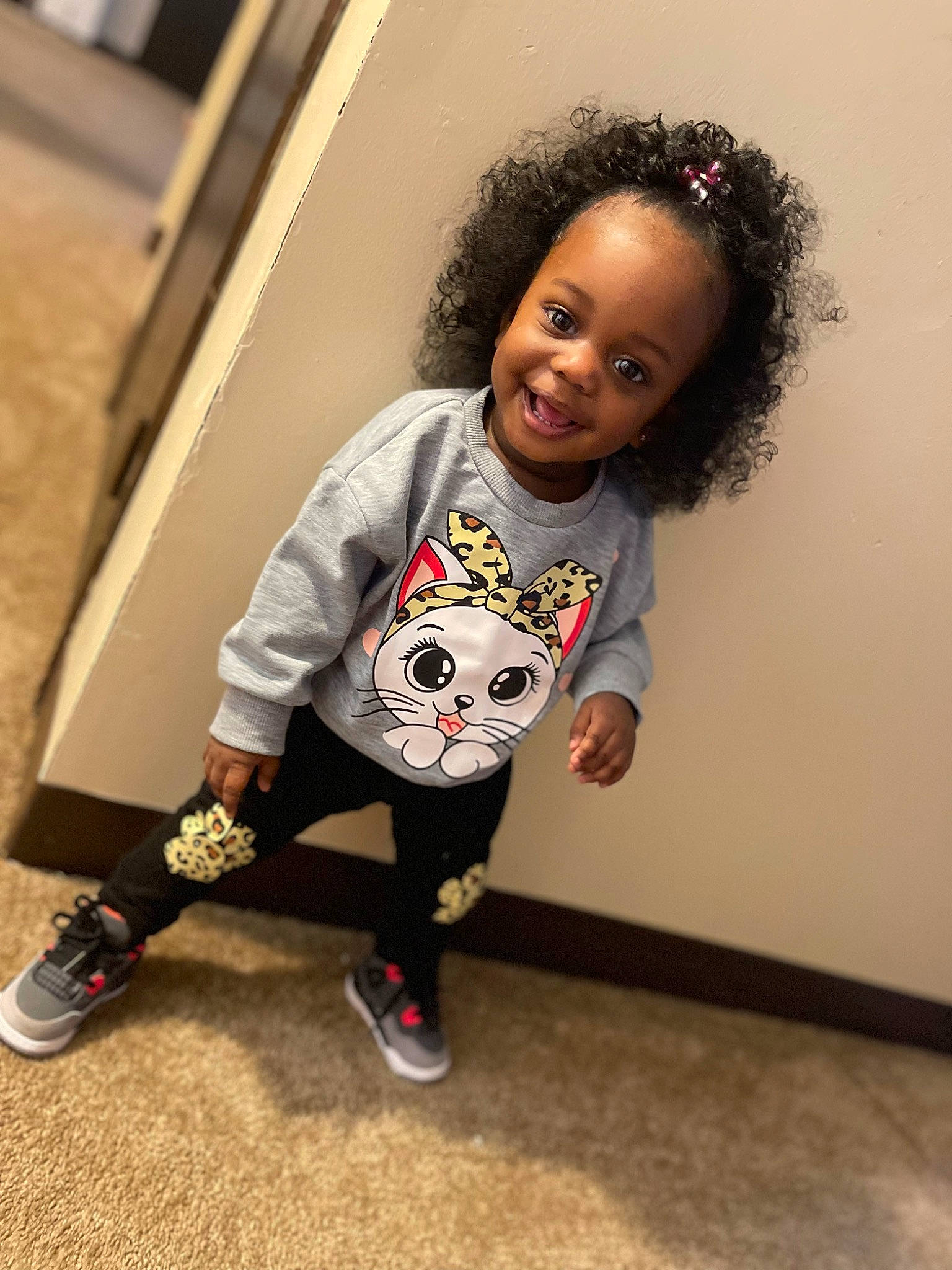 Kari joined the competition — help win amazing prizes! baby_toddler_clothing, carmine, cheek, child, cool, eye, fashion_design, floor, flooring, fun, happy, joy, knee, pattern, person, sitting, sleeve, smile, sock, t_shirt