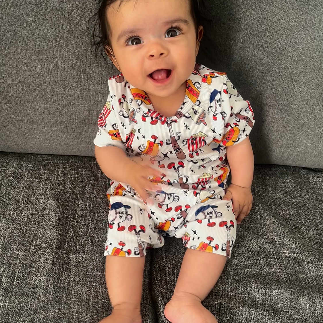 Willow joined the competition — help win amazing prizes! baby, babylaughing, clothing, couch, dress, face, furniture, happy, head, laughing, pajamas, person, photography, portrait, shorts, sitting, sleeve, smile