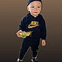 backwards_cap, black_clothing, boy, cap, casual, child, cute, fashion, golden_toy, hoodie, isolated, nike, portrait, smiling, sneakers, standing, studio_background, toddler, toy, young_child