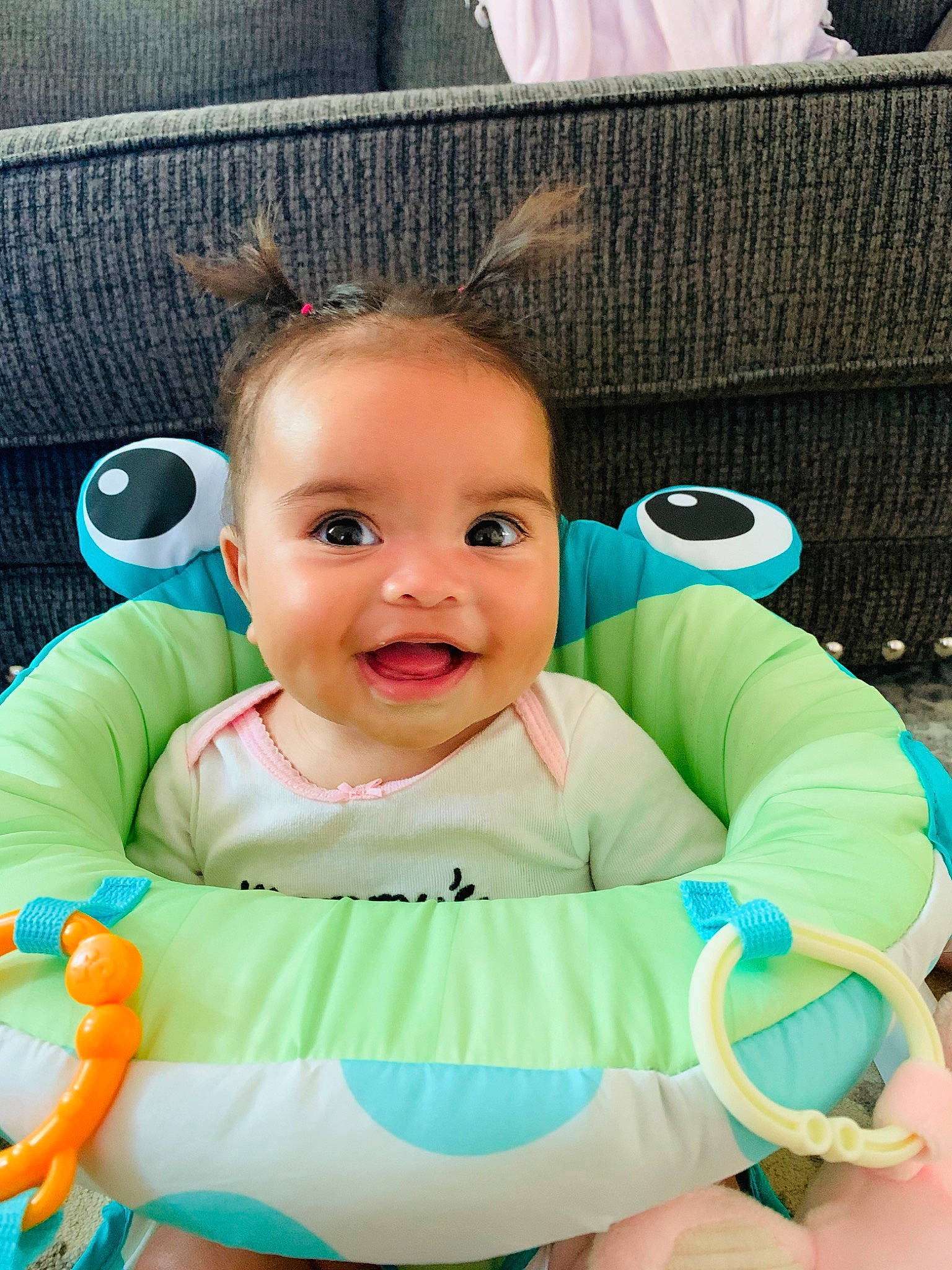 Kami is registered to the contest to win money with this photo: baby, baby_products, baby_toddler_clothing, baby_toys, cheek, child, ear, eye, face, head, joy, nose, person, play, product, sitting, skin, smile, toddler