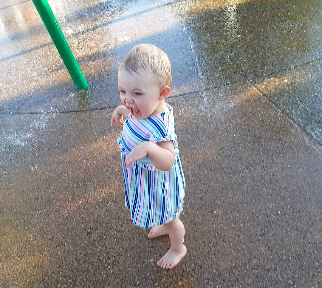 April joined the competition — help win amazing prizes! asphalt, baby, baby_toddler_clothing, barefoot, child, city, concrete, flooring, foot, fun, grass, leisure, people_in_nature, person, play, recreation, road, road_surface, sidewalk, t_shirt